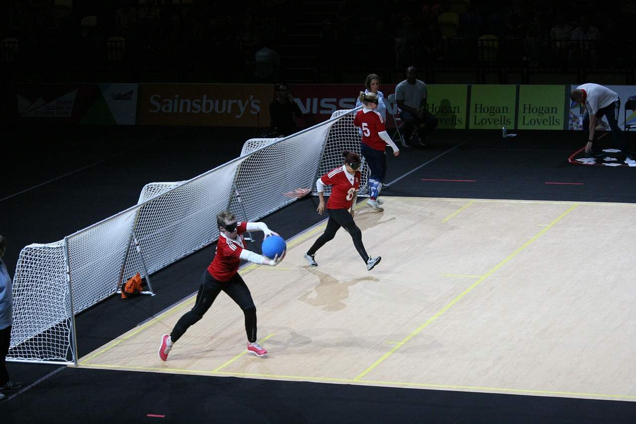 Visually Impaired Competitors playing Goalball – note that they all wear dark shades to ensure that none can see and the game is fair